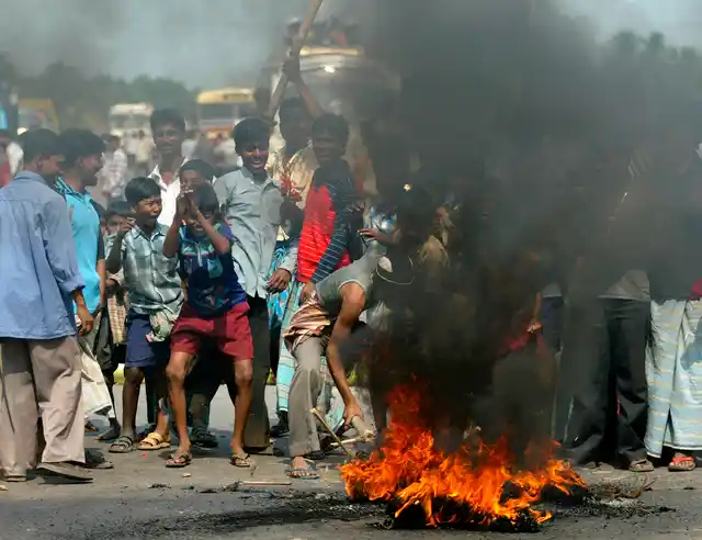15 March 2007: Protesters set fire as they block a highway near Nandigram.
