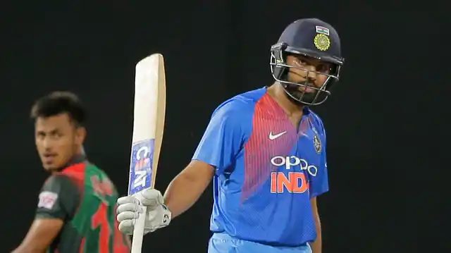 India’s Rohit Sharma celebrates scoring fifty runs against Bangladesh during their second Twenty20 cricket match in Nidahas triangular series in Colombo, Sri Lanka, Wednesday
