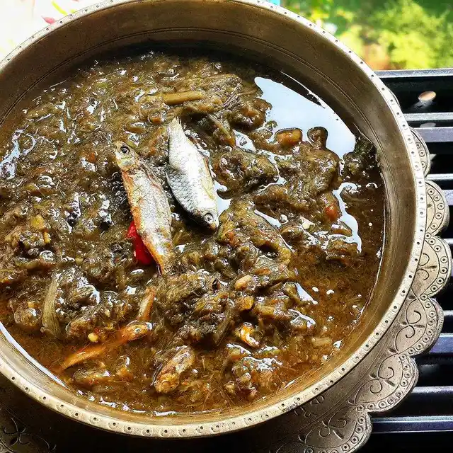 Kosuthuri Hukoti Maas (tender Colocasia leaves) cooked with smoked pond fishes.
