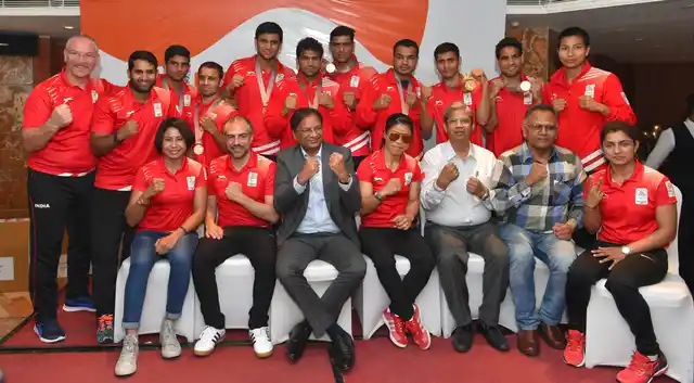 Boxers, who won medals at the Commonwealth Games, with President, Boxing Federation of India (BFI), Ajay Singh and others at a felicitation ceremony in New Delhi on 17 April.
