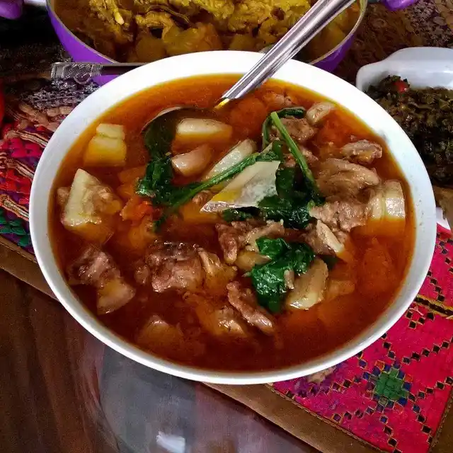 Naga style plain pork boiled with seasonal herbs.
