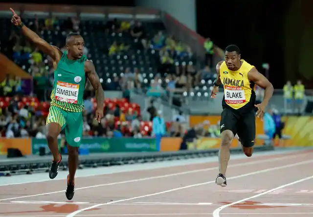 South Africa’s Akani Simbine, left, celebrates after winning the men’s 100m final at Carrara Stadium during the 2018 Commonwealth Games on the Gold Coast, Australia, Monday, April 9, 2018. Jamaica’s Yohan Blake, right, finished third.