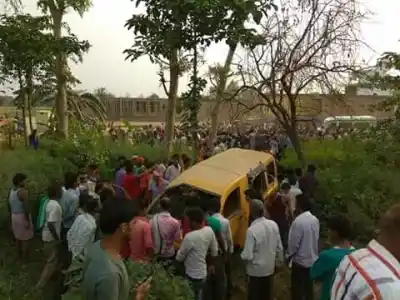 Kushinagar (Uttar Pradesh): People gather around the school van which collided with a train at an unmanned railway crossing in Uttar Pradesh