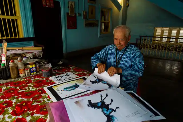 Lee Kar Shong, 88, a Chinese-Indian painter and calligrapher, works at his home in the new China town of Tangra. Shong was born in Kolkata but speaks only Chinese.