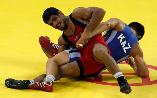 Sushil Kumar fights Leonid Spiridonov of Kazakhstan during their 66 kg men’s freestyle wrestling bronze medal match at the Beijing Olympic Games. 