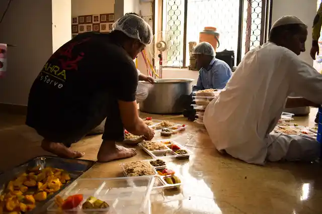 Vounteers of the Zahra foundation packing the food parcels for Iftaar.