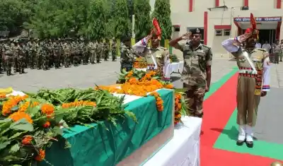 Jammu: Soldiers pay tribute to BSF constable Sitaram Upadhyay who was killed in Pakistan firing on the international border (IB) in Jammu and Kashmir in Jammu on May 18, 2018. (Photo: IANS)