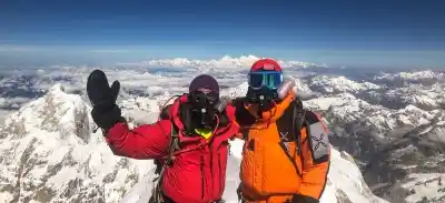 Mountaineer Arjun Vajpai (left) at the Kanchenjunga summit.