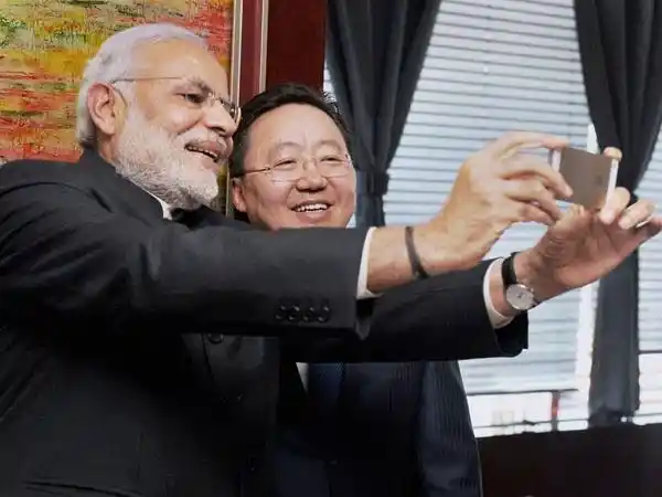 Indian Prime Minister Modi with Mongolian Premier Tsakhiagiin Elbegdorj taking a selfie with his iPhone 5s.