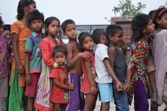 Children queue up to claim their parcels.