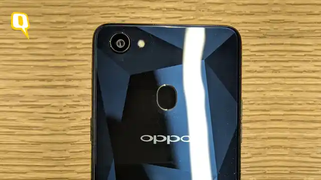 The phone uses a plastic back with a faux metal look.