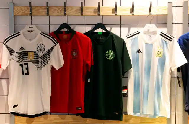 National soccer team jerseys of Germany, from left, Portugal, Nigeria (away) and Argentina are on display at a shop in London. 