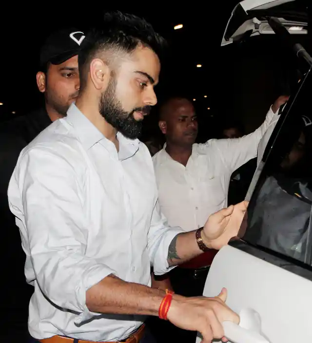 Virat Kohli looking sharp as ever at the airport.