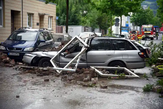 A car is destroyed after an explosion of a house in Wuppertal, Germany, 24 June, 2018.
