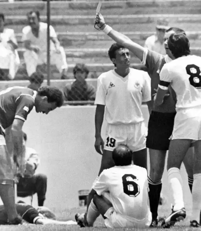 In this 13 June 1986 filer, French referee Joel Quiniou, rear right, shows the red card to Uruguayan player Jose Batista, No 6, for a bad tackle on Scotland’s Gordon Strachan, on the floor left, just one minute after the start of the Football World Cup match between Scotland and Uruguay in Mexico City, Mexico. The first red card of the Russia 2018 World Cup tournament has been awarded against Colombia midfielder Carlos Sanchez for handling a goal-bound shot in the area in the third minute against Japan. Shinji Kagawa slotted the resultant penalty to give Japan an early 1-0 lead in the World Cup Group H game. 
