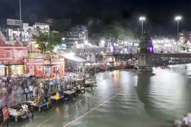 The dense crowds at the banks of the rivers, a flowing river of humanity in itself.