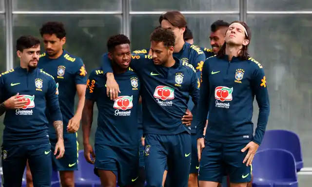 Brazil’s Neymar puts his arm around Fred during the training session at Enfield Training Ground, London, Britain on 5 June 2018. 