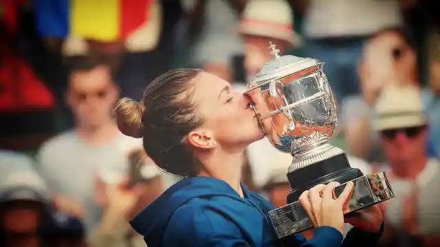 Romania’s Simona Halep kisses the cup after defeating Sloane Stephens of USA during their final match of French Open tennis at the Roland Garros stadium.