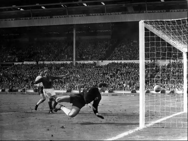 In this July 30, 1966 file photo, a shot from Geoff Hurst bounces down from the West Germany crossbar during the World Cup final at London’s Wembley Stadium. The linesman gave it as a goal and England went to to win 4-2. 