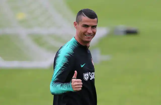 Portugal’s Cristiano Ronaldo gestures during a team training session, in Oeiras, outside Lisbon on 4 June.
