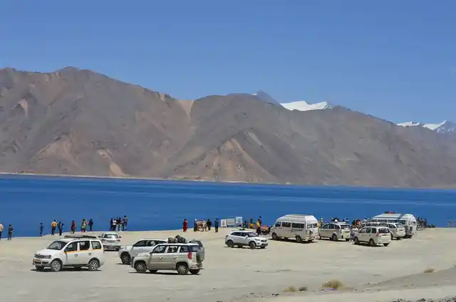 According to Leh officials over 600 vehicles go to Pangong Lake every day. Many of these vehicles go right up to the lake shore, although a sign cautions tourists that this is forbidden.
