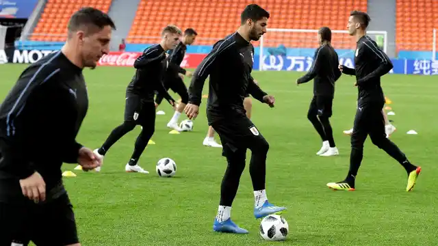 Uruguay’s Luis Suarez (centre) dribbles the ball during Uruguay’s official training on the eve of the group A match between Egypt and Uruguay at the 2018 FIFA World Cup.