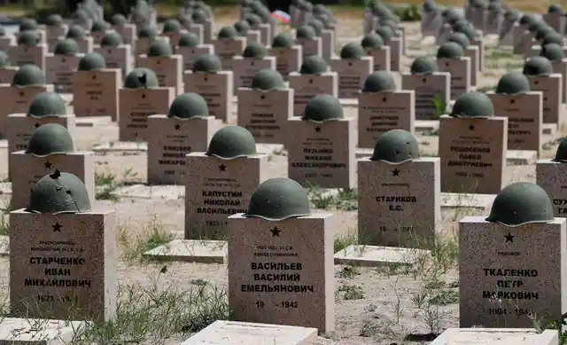 In this photo taken on Sunday, June 17, 2018, graves of Russian soldiers in a cemetery near Stalingrad in Rossoshka, Russia.