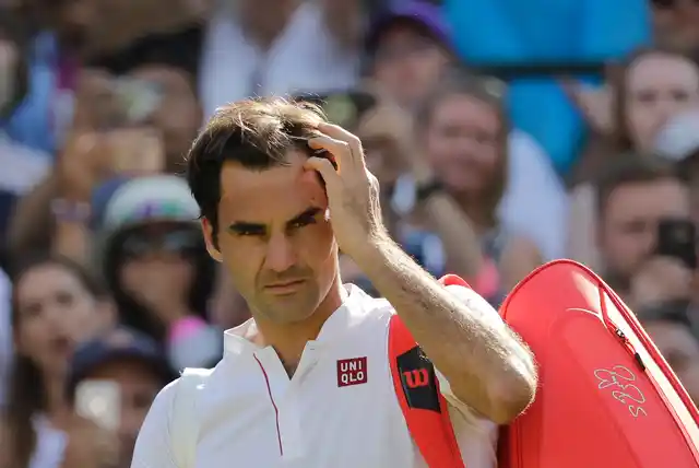 Switzerland’s Roger Federer prepares to leave the court after losing his men’s quarterfinals match against Kevin Anderson of South Africa, at the Wimbledon Tennis Championships, in London, Wednesday July 11, 2018.