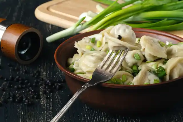Pelmeni are pastry dumplings consisting of a filling of pork and meat, wrapped with unleavened dough.