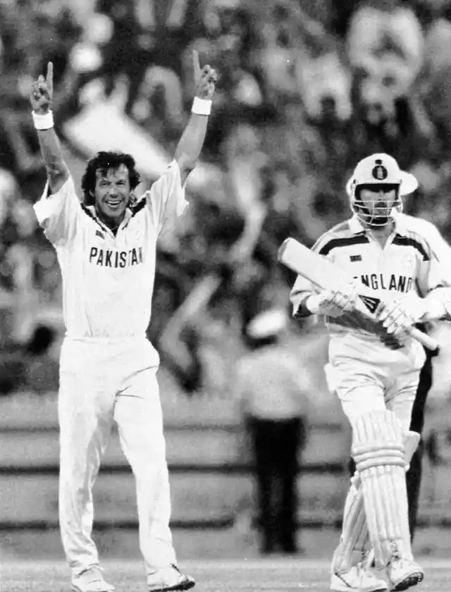 Pakistan captain Imran Khan (left) raises his arms in triumph, as England’s last batsman Richard Illingworth (right) walks away after being given out during the World Cup Cricket Final, in Melbourne, Australia.