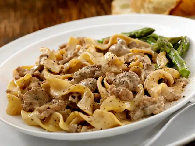 It is eaten hot otherwise the succulent beef gets stuck in the sour cream sauce.