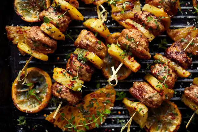 Shashlik is a shish kebab made by grilling chunks of meat over an open fire with herb leaves tossed in to enhance the flavour.