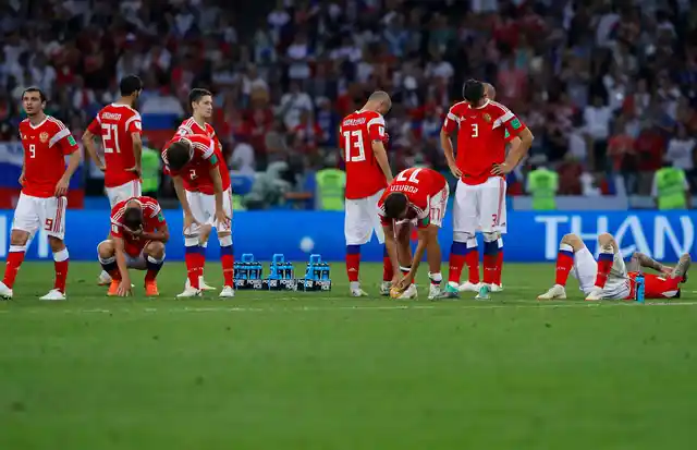 Russia national soccer team players react at the end of the quarter-final match between Russia and Croatia.
