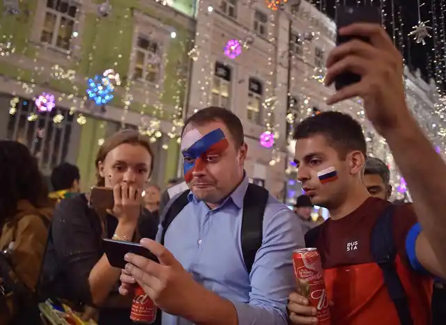 Russia’s fans react after Russia’s loss in the quarter-final match between Russia and Croatia.