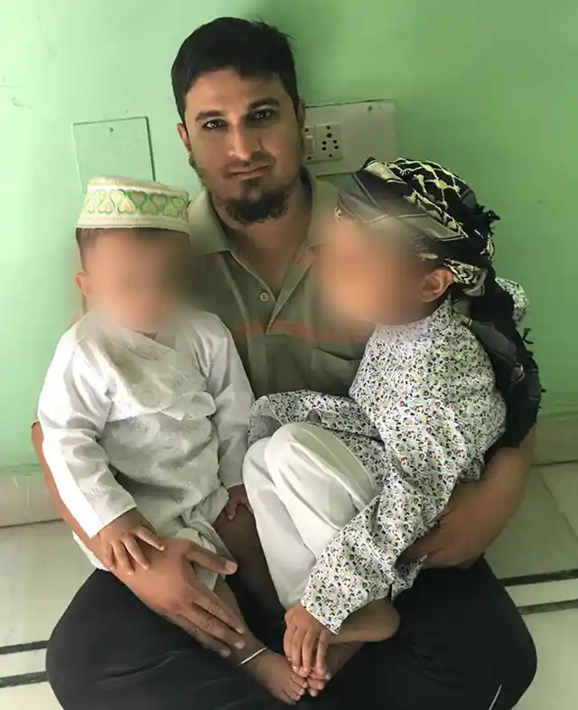Mohammed Azam with his son (left) and nephew (right) .