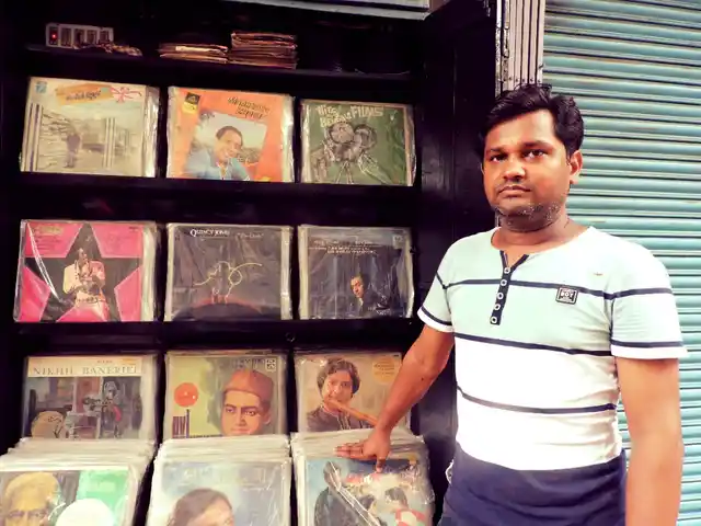 Md. Shah Nawaz in front of his store that was set up by his grandfather.