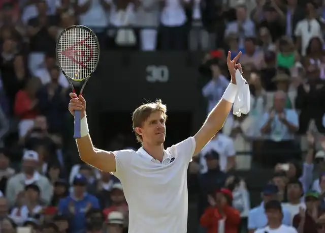 Kevin Anderson celebrates his victory over Roger Federer at Wimbledon.
