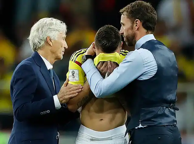Colombia head coach Jose Pekerman, left, and England head coach Gareth Southgate, right, comfort Colombia’s Mateus Uribe after the round of 16 match between Colombia and England at the 2018 FIFA World Cup in the Spartak Stadium, in Moscow, Russia, Tuesday, July 3, 2018.