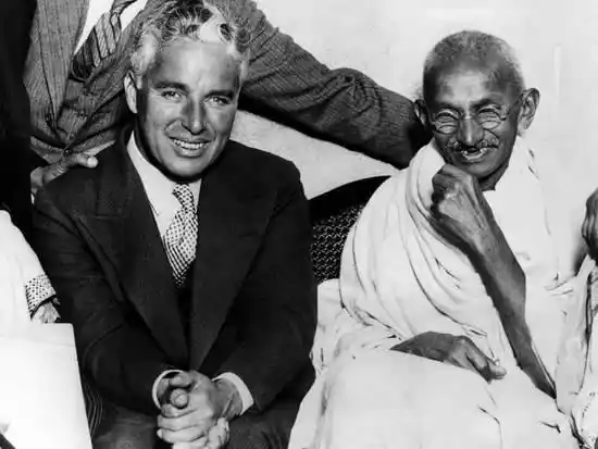Charlie Chaplin with Mahatma Gandhi.