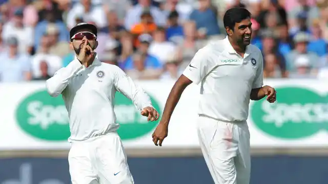 Virat Kohli celebrates a wicket with Ravichandran Ashwin.