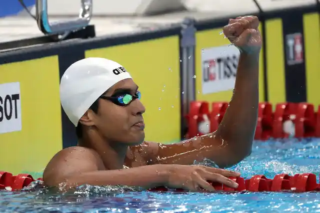 India’s Srihari Nataraj reacts after winning Heat 1 of the men’s 100m backstroke during swimming competition at the 18th Asian Games in Jakarta, Indonesia, Sunday, Aug. 19, 2018.
