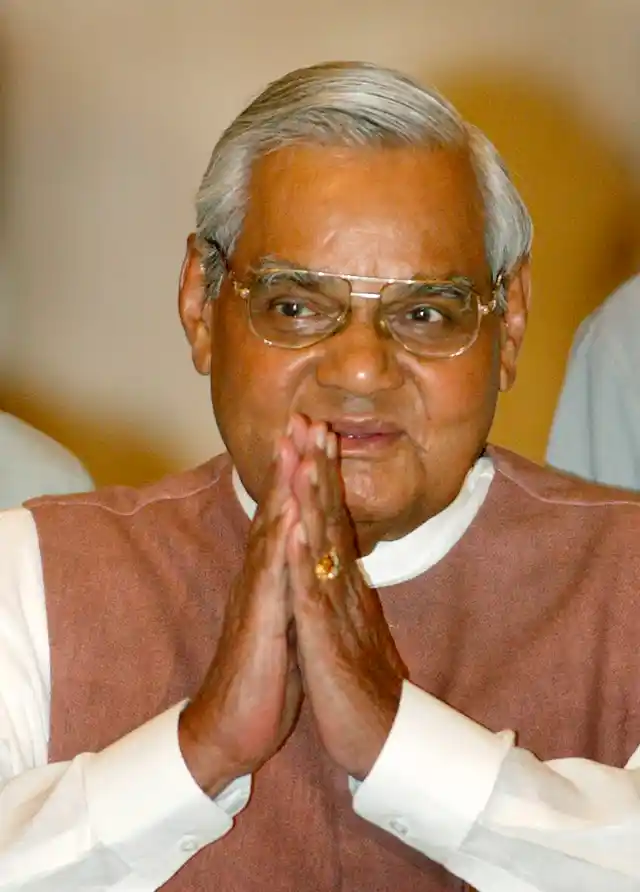 2 May, 2004 file photo, Atal Bihari Vajpayee greets the audience as he arrives for a ceremony at the Presidential Palace.
