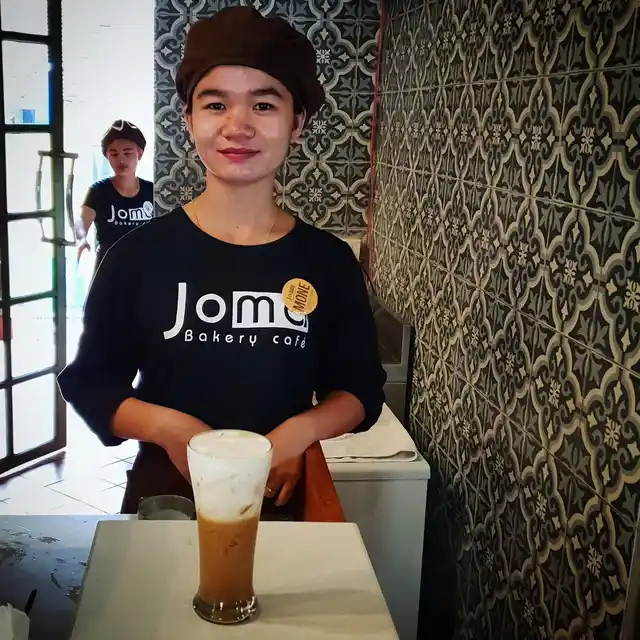 A chilled glass of Laotian coffee.