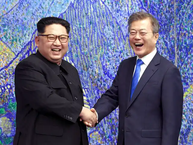 North Korean leader Kim Jong Un, left, poses with South Korean President Moon Jae-in for a photo inside the Peace House at the border village of Panmunjom in Demilitarized Zone, South Korea.