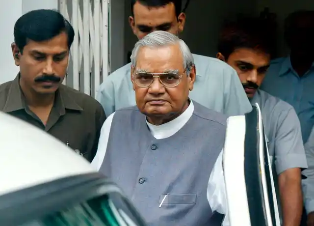 23 Aug, 2004 file photo, senior Bharatiya Janta Party (BJP) leader Atal Bihari Vajpayee, center, leaves after a meeting at the party headquarters in New Delhi. 
