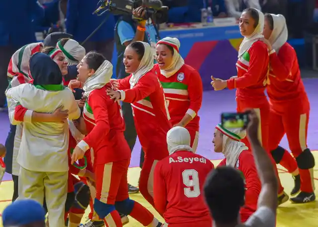 Iran’s team, in red, react after defeating India in the women’s kabaddi gold medal match at the 18th Asian Games in Jakarta, Indonesia.