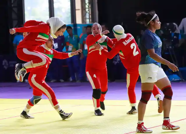 Iran’s team, in red, react after defeating India in the women’s kabaddi gold medal match at the 18th Asian Games in Jakarta, Indonesia.