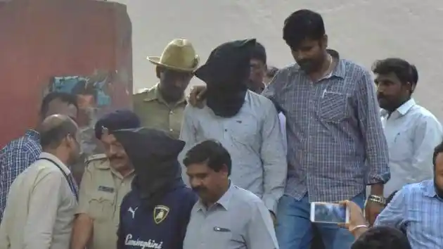 Ganesh Miskin and Amit Batti, after being produced before a court in Bengaluru. 