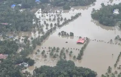 Kerala: An aerial view of the flood-hit areas of Kerala on Aug 18, 2018. Overflowing rivers and a series of landslides have caused the death of 180 people as of Saturday morning, with over three lakh people forced to move to some 2,000 relief camps. The disaster has triggered an unprecedented rescue and relief operation led by the Army, the Air Force and the Navy along with teams of National Disaster Response Force involving about 1,300 personnel and 435 boats. Prime Minister Narendra Modi on Sa