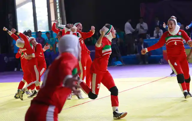 Iran’s team, in red, react after defeating India in the women’s kabaddi gold medal match at the 18th Asian Games in Jakarta, Indonesia.